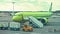 Moskow, Russia, August 30, 2020, Closeup view of S7 airplane standing in airport and people working nearby outdoors.