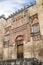 The Mosque Cathedral in Cordoba, Spain. Exterior wall with great golden door - famous landmark in Andalusia