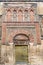 The Mosque Cathedral in Cordoba, Spain. Exterior wall with great golden door - famous landmark in Andalusia