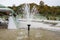 Mosque with fountain in front, with large glass building. High quality photo