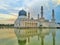 Mosque reflection in the lake with sunrise background