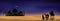 Mosque silhouette with Arab family and camel walking in desert sands in evening sunset with dark blue and pink sky,Islamic mosque