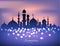 Mosque silhouette in sunset sky and candles light for ramadan of