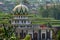 A mosque that stands in the middle of a field area, used by rural residents for worship