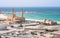 Mosque with to minarets and a small fort with ocean in background on a hot sunny day. Travel in the Musandam peninsula