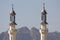 Mosque Towers Rise Above Mountains