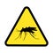 Mosquito on a yellow triangular sign, attention to the danger of blood-sucking parasites that are carriers of malaria