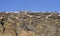 Moss-covered igneous rock against a blue Icelandic sky