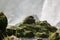 Moss-covered rocks sprayed by the fierce waters of Ban Gioc Waterfalls