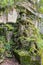 Moss covered sculptures in a cemetery of the English, San Sebastian, Euskadi, Basque Country, Spain