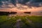 Moss covered stones by the sea under the beautiful cloudy sky captured in Canggu, Bali