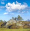 Moss covering rock boulders in remote a countryside or meadow in Norway. Algae covered landscape in quiet, serene