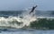 Mossel Bay, South Africa. Surfing the waves. Surfer riding wave,  storm sky