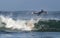 Mossel Bay, South Africa. Surfing the waves. Surfer riding wave,  storm sky