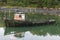 Mossy abandoned boat on a lake