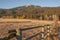 Mossy Split Rail Fence along the brown field