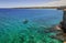 The most beautiful coast of Apulia: Torre Dell`Orso Bay, ITALY Lecce. Typical seascape of Salento: view of boat in the crystal