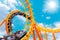 Most exciting roller coaster drive high to summer sky at theme park, people excited fun and joyful playing machine in holiday