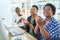 The most productive meetings leave everyone feeling motivated. a group of businesspeople clapping during a meeting in a