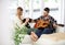 The most relaxing of afternoons. a young man playing the guitar for his girlfriend while sitting on their sofa.