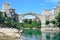 Mostar, Bosnia and Herzegovina, June, 23, 2015. People walking near old bridge in Mostar. Included to the UNESCO heritage