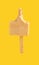 a mostly eaten milk tea flavor popsicle on yellow background