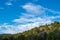 Mostly Sunny Skies above a Pinyon Juniper Woodland