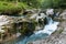 Mostnica river flowing over limestone karst formation, Slovenia