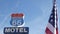 Motel retro sign on historic route 66 famous travel destination, vintage symbol of road trip in USA. Iconic lodging