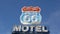 Motel retro sign on historic route 66 famous travel destination, vintage symbol of road trip in USA. Iconic lodging