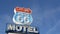 Motel retro sign on historic route 66 famous travel destination, vintage symbol of road trip in USA. Iconic lodging