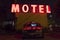 Motel sign illuminated at night