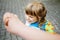 Mother accompanies preschool girl to daycare or school. Mom encourages student child to accompany her to school. Caring