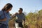 Mother And Adult Daughter Hiking Outdoors In Countryside