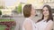 Mother and adult daughter laughing and chatting in the park on a sunny day. Attractive Brunette is Hugging Her Mom with