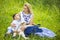 Mother Along with Her Little Son and Cub of Newborn Lamb Posing Outdoors on Nature Background