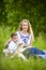 Mother Along with Her Little Son and Cub of Newborn Lamb Posing Outdoors on Nature Background