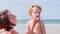 Mother apply sunscreen uv cream carrying for little blond boy