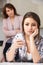 Mother Arguing With Daughter Over Use Of Mobile Phone