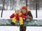 Mother with baby on bench. winter