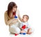 Mother and baby boy having fun with musical toys