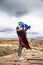 Mother and baby boy traveling enjoying a vacation in desert Cappadocia Turkey. Mom and tourist kid in blue clothing outdoor portra