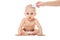 Mother and baby combing hair. Little boy in clean dry nappy isolated on a white background. Mom taking care of infant child .