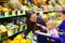 Mother and baby daughter in supermarket