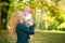 Mother and baby kissing in nature outdoor