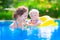 Mother and baby in swiming pool