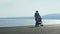 Mother with baggy walking along Nice embankment, enjoying amazing seascape