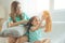 Mother Braiding hair To her daughter