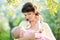 Mother breast feeding baby outdoors