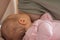 Mother breast feeding and hugging a cute baby and one month newborn girl